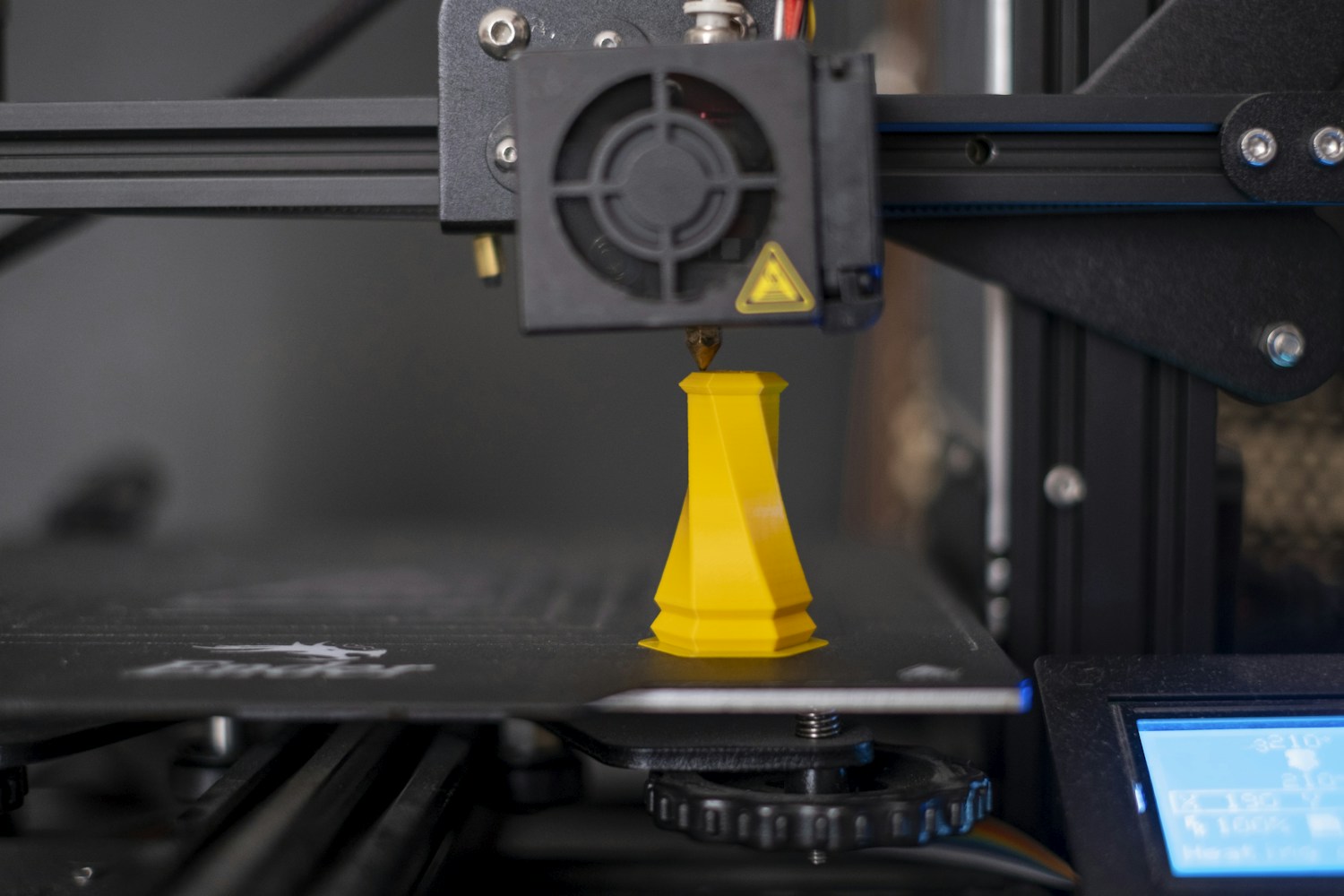 A 3D printer laying down filament